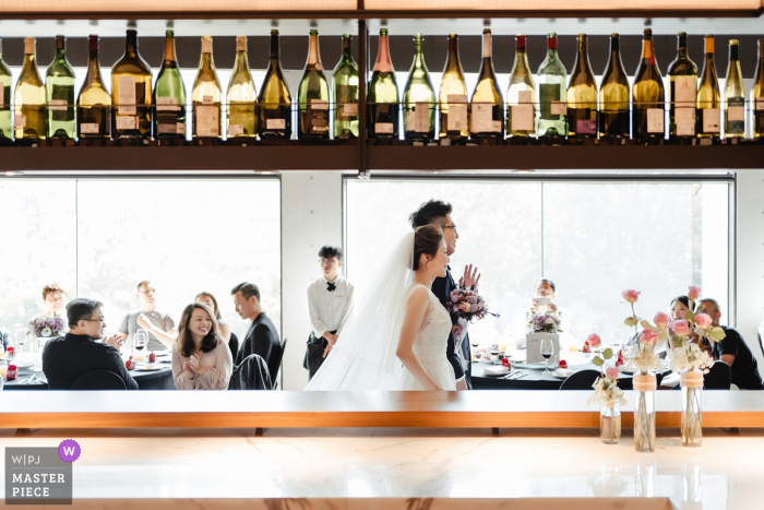Photo by: <a href="https://www.wpja.com/contests/2019-v17/best-wedding-photographers/2564260">ChiangYuan Hung - Taipei </a> Taipei Taiwan wedding photography showing the bride and groom entering the reception bar area.