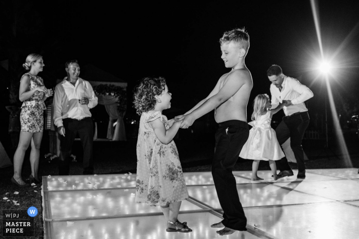 a night event with a Young cute couple dancing The Ritz Dubai wedding venue photos from night event | Young cute couple dancing