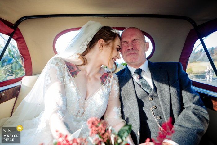 Photo by: <a href="https://www.wpja.com/contests/2019-v17/best-wedding-photographers/2564759">Mike Cook - Larbert Stirlingshire</a> Scotland Wedding Reception Photographer: Bride & her tearful father arriving for the ceremony.