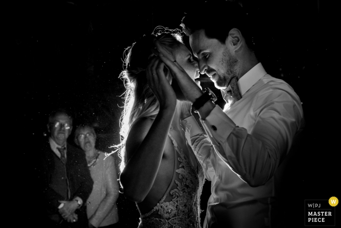 Photo by: <a href="https://www.wpja.com/contests/2019-v17/best-wedding-photographers/2564791">Fille Roelants - Antwerpen Antwerpen</a> Reception venue photography - bride and groom are having their first dance, while her grandparents are watching them from the background - Flanders wedding photos