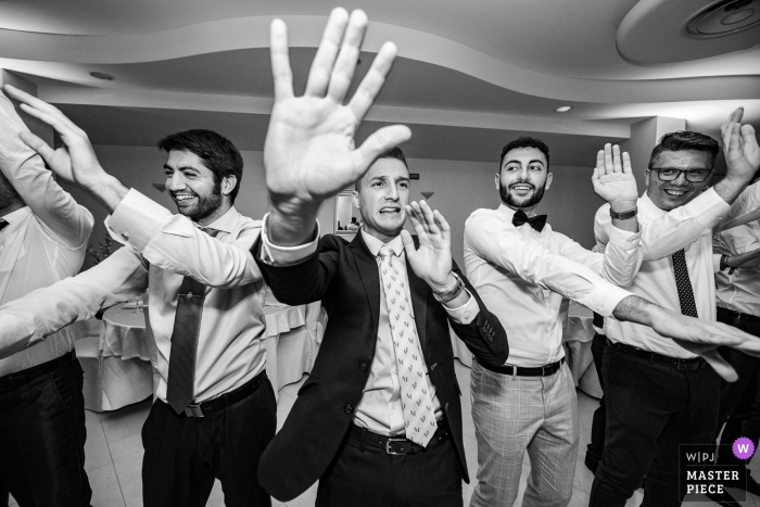 Photo by: <a href="https://www.wpja.com/contests/2019-v17/best-wedding-photographers/2564903">Sergio Cueto - Alcala de Henares Madrid</a> Spain wedding day photography - Dance floor energy with the men dancing with their hands
