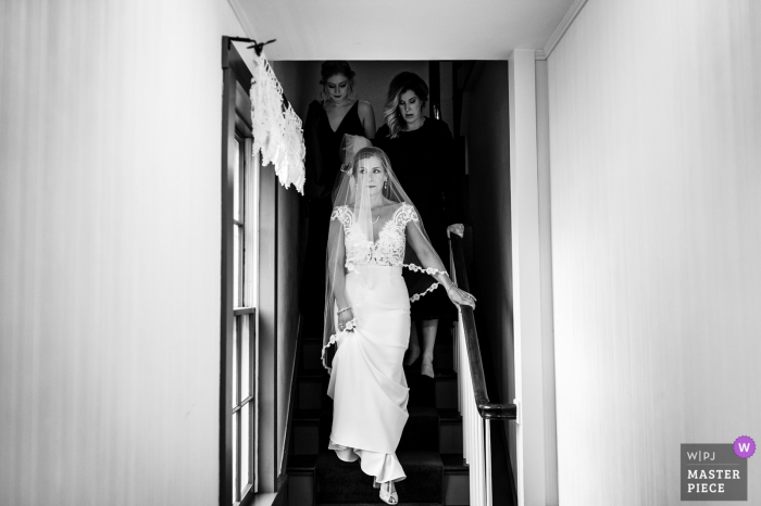 Photo by: <a href="https://www.wpja.com/contests/2019-v17/best-wedding-photographers/2564980">Megan Hannah - Lincoln Vermont</a> Venue photography on wedding day from Grafton Inn in Grafton, VT (getting ready location) - The bride walks down the stairs before the ceremony begins.