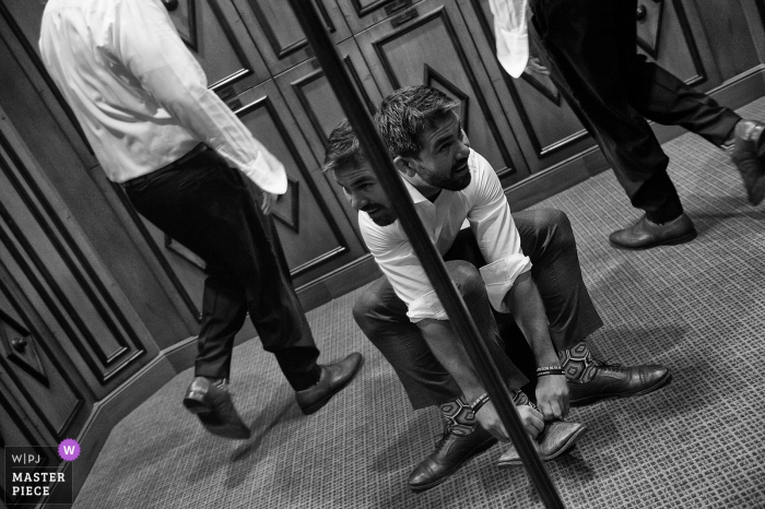 Photo by: <a href="https://www.wpja.com/contests/2019-v17/best-wedding-photographers/2565068">Matt Theilen - South Lake Tahoe California</a> Photos from wedding day at Truckee, California - Groom putting on shoes