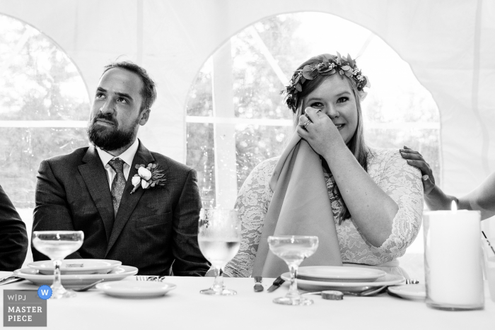 Photo by: <a href="https://www.wpja.com/contests/2019-v17/best-wedding-photographers/2565128">Kate Crabtree - Bangor Maine</a> Wedding photos from Sugarloaf Mountain, Maine | A bride cries during toasts