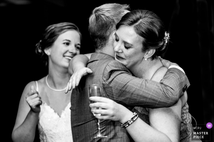 Photo by: <a href="https://www.wpja.com/contests/2019-v17/best-wedding-photographers/2565130">Miguel Gonzalez - Abington Pennsylvania</a> Duportail House Wayne PA wedding reception photography | Grooms sister after a toast. Caught the tear.
