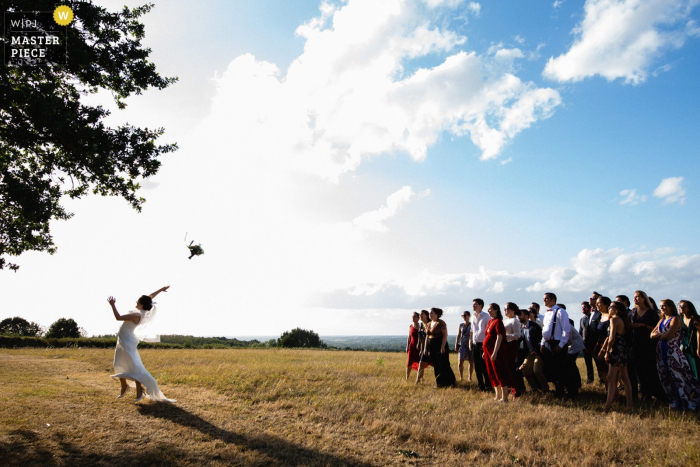 Photo by: <a href="https://www.wpja.com/contests/2019-v18/best-wedding-photographers/2567663">Jeremy Fiori - Angers </a> Chateau de l'Eperonnière Wedding Photography of the Bouquet Toss Outside in Nature