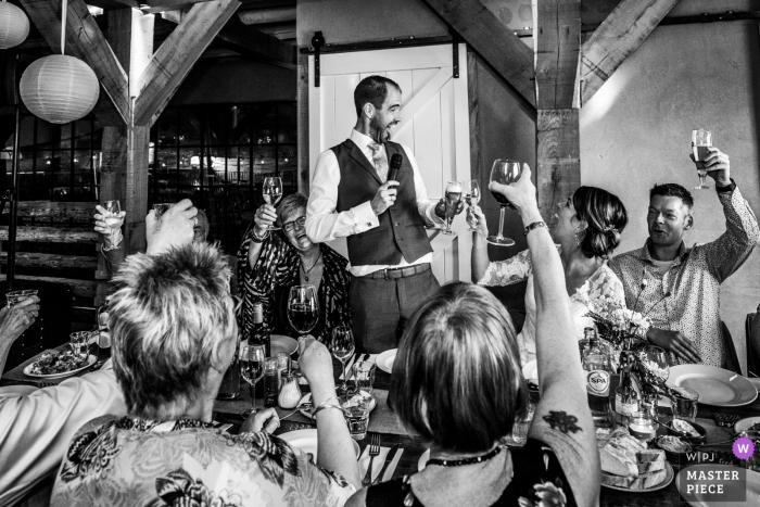 Photo by: <a href="https://www.wpja.com/contests/2019-v18/best-wedding-photographers/2565456">Karin Bunschoten - Leusden Utrecht</a> Netherlands Reception Venue Photo: Funny "cheers" moment before dinner