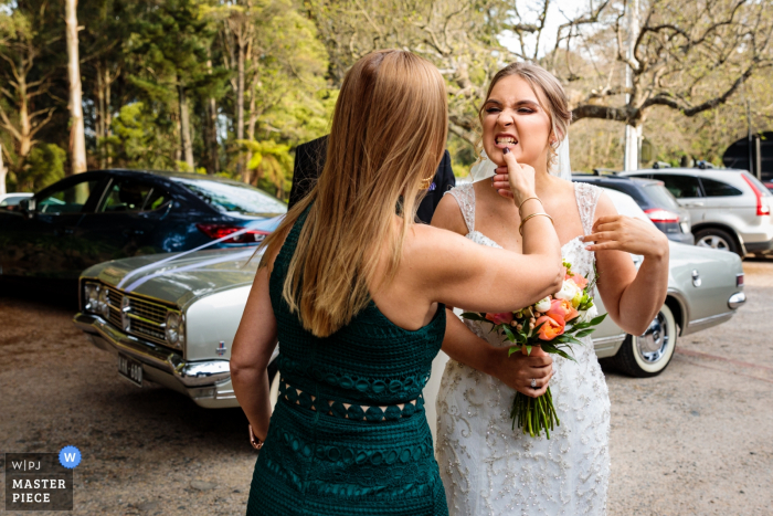 Photo by: <a href="https://www.wpja.com/contests/2019-v18/best-wedding-photographers/2565504">Alan Rogers - Doncaster East Victoria</a> Victoria, Australia wedding photographer: The Mother of the bride checking her daughters teeth!