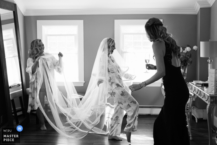 Photo by: <a href="https://www.wpja.com/contests/2019-v18/best-wedding-photographers/2565624">Alex Gordeev - Randolph Massachusetts</a> Dennis Inn, Cape Cod, MA - The moment from bride's getting ready