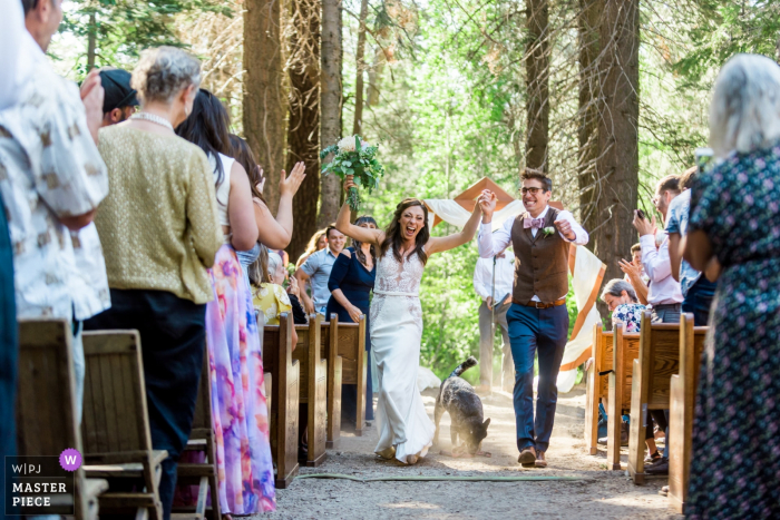 Photo by: <a href="https://www.wpja.com/contests/2019-v18/best-wedding-photographers/2565636">Lauren Lindley - South Lake Tahoe California</a> A bride and groom recess at their summer camp wedding outside of Lake Tahoe, CA