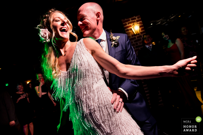 Photography at the Wedding Venue : Ironworks (Denver, CO) - Bride and groom cutting a rug during the dance party. 