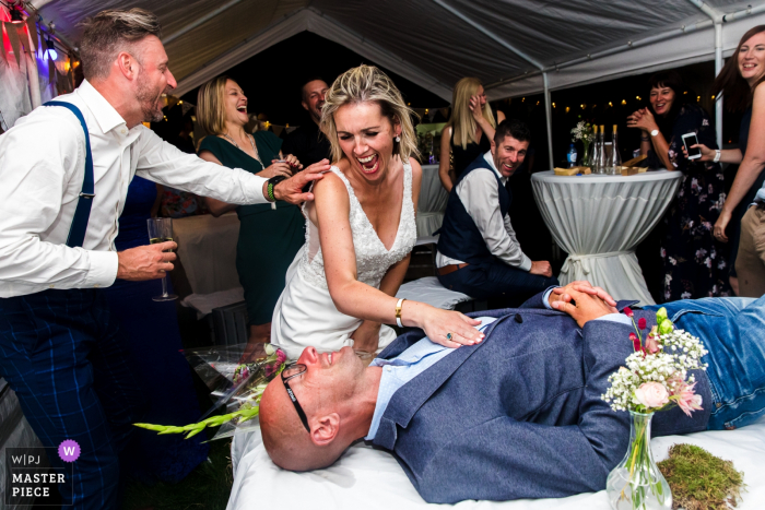 Photo by: <a href="https://www.wpja.com/contests/2019-v18/best-wedding-photographers/2566241">Philippe Swiggers - Bekkevoort </a> Vlaams-Brabant Wedding Reception Party Picture | Bride and groom with guest having fun with them