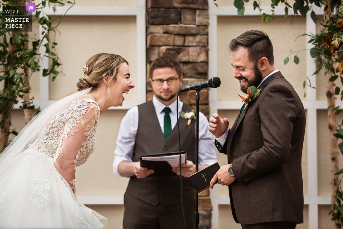 Photo by: <a href="https://www.wpja.com/contests/2019-v18/best-wedding-photographers/2566417">Todd Laffler - High Bridge New Jersey</a> New Jersey wedding photo of the Bride and Groom laughing during ceremony