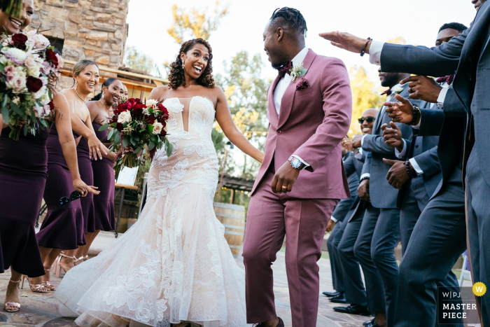 Photo by: <a href="https://www.wpja.com/contests/2019-v18/best-wedding-photographers/2566498">Kristina Cazares Neri - San Diego California</a> Lake Oak Meadows, Temecula, California wedding venue photo of the Couple entering the reception