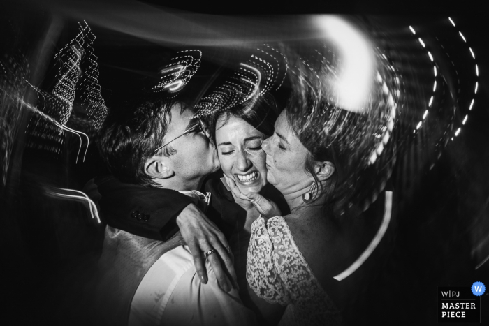 Photo by: <a href="https://www.wpja.com/contests/2019-v18/best-wedding-photographers/2566560">Patrick Lombaert - Plelan le Petit </a> Parnay, France wedding photo with slow shutter of a Hug of bride and groom