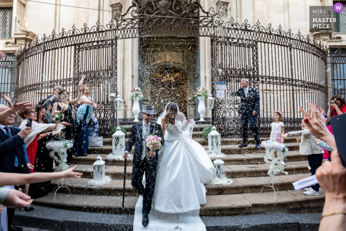 Photo by: <a href="https://www.wpja.com/contests/2019-v18/best-wedding-photographers/2566765">Salvo Moroni - Viagrande Catania</a> Launch of rice immediately after the wedding, in typical Italian style | Chiesa San Giuliano