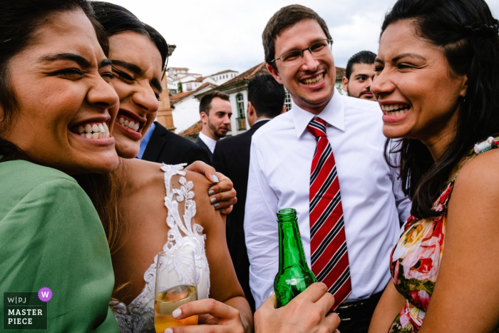 Photo by: <a href="https://www.wpja.com/contests/2019-v18/best-wedding-photographers/2567031">Vinicius Terror - Ouro Preto Minas Gerais</a> Minas Gerais Brazil Reception Venue Photography of the bride hugging friends