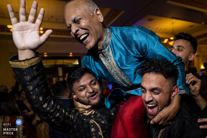 Photo by: <a href="https://www.wpja.com/contests/2019-v18/best-wedding-photographers/2567337">Joshua Grasso - Buford Georgia</a> Wedding photography from the Embassy Suites St Charles Missouri - Giving the brides dad a lift