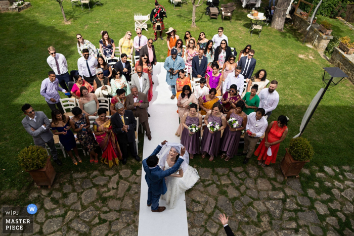 Photo by: <a href="https://www.wpja.com/contests/2019-v18/best-wedding-photographers/2567419">Damiano Salvadori - Certaldo Firenze</a> Umbria Italy Casa Bruciata resort outdoor wedding ceremony photo of the groom remove the veil of the bride