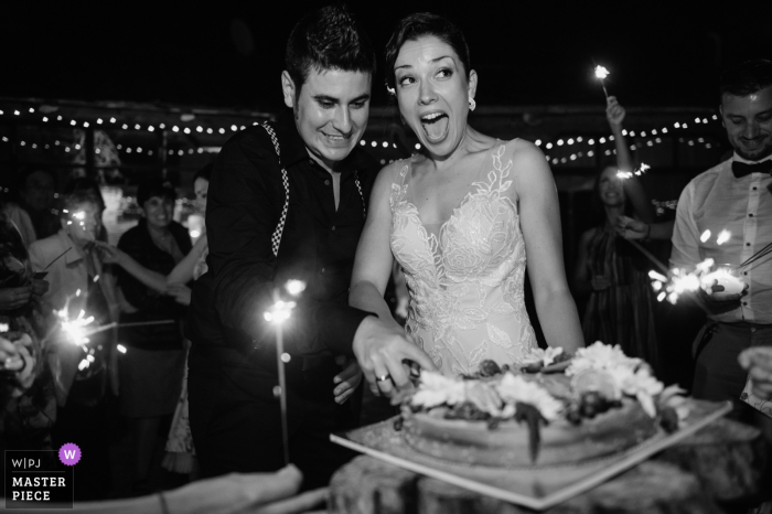 Photo by: <a href="https://www.wpja.com/contests/2019-v18/best-wedding-photographers/2567424">Linda Alexandriyska - Sofia Sofia</a> Bar Bedouin, Sevlievo, Bulgaria - Bride and Groom during the Cake cutting