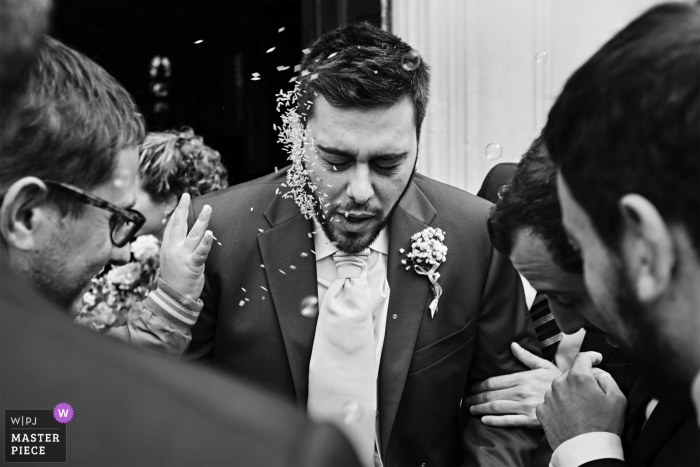 Photo by: <a href="https://www.wpja.com/contests/2019-v18/best-wedding-photographers/2567558">Matteo Reni - Busto Arsizio Varese</a> Chiesa San Michele, Magnago - ITALY | Rice throwing on Groom's face