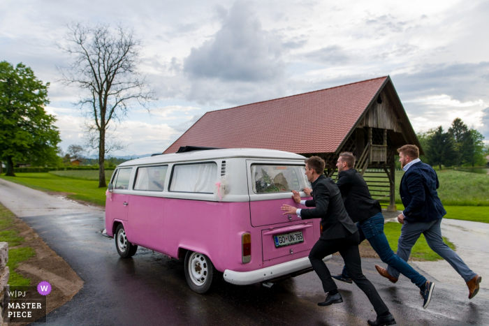 Photo by: <a href="https://www.wpja.com/contests/2019-v18/best-wedding-photographers/2567570">Goran Vadlja Kamenjašević - Velenje </a> Castle Štanjel, Slovenia wedding transportation photo of pink VW bus: You wanted the old one