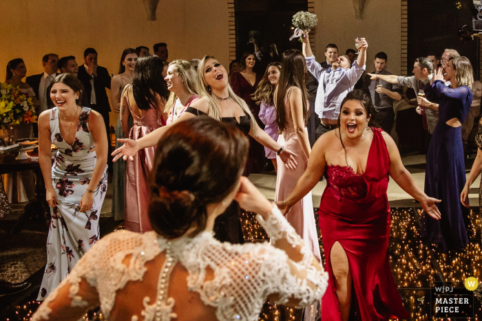 Photo by: <a href="https://www.wpja.com/contests/2019-v18/best-wedding-photographers/2567642">Renan Radici - Porto Alegre Rio Grande do Sul</a> Casa Valduga wedding photography - Godfather taking the Bride's Bouquet while bridesmaids don't understand