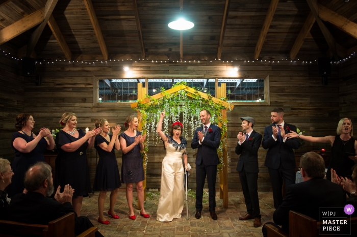 Photo by: <a href="https://www.wpja.com/contests/2019-v18/best-wedding-photographers/2567665">Jiake Yang - Melbourne Victoria</a> Victoria-AU wedding photography from inside a barn ceremony | Witness announces that the bride and groom are married