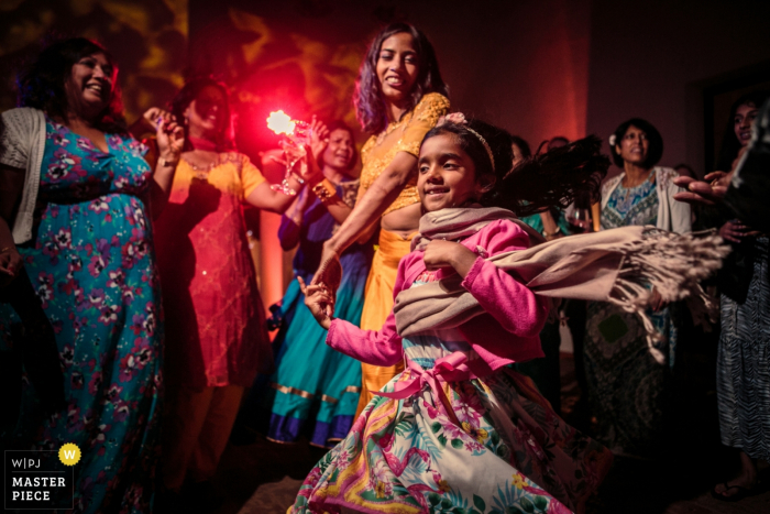 Photo by: <a href="https://www.wpja.com/contests/2019-v18/best-wedding-photographers/2567746">Fabio Azanha - Lisbon </a> Wedding photos from the hotel Tivoli Evora | Girl dancing with the bride