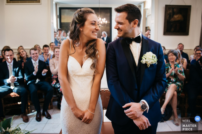Photo by: <a href="https://www.wpja.com/contests/2019-v18/best-wedding-photographers/2567841">Fille Roelants - Antwerpen Antwerpen</a> Flanders town hall wedding picture. The bride and groom to be are getting excited to have their first kiss as a married couple