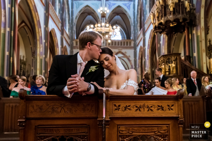 Photo by: <a href="https://www.wpja.com/contests/2019-v18/best-wedding-photographers/2567844">Isabelle Hattink - Rotterdam Zuid Holland</a> Amsterdam - Krijtbergkerk wedding ceremony photography | a kiss in the church