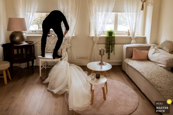 Photo by: <a href="https://www.wpja.com/contests/2019-v18/best-wedding-photographers/2567849">Isabelle Hattink - Rotterdam Zuid Holland</a> Bunnik wedding pictures of the mother of the bride getting the dress - Getting ready photography