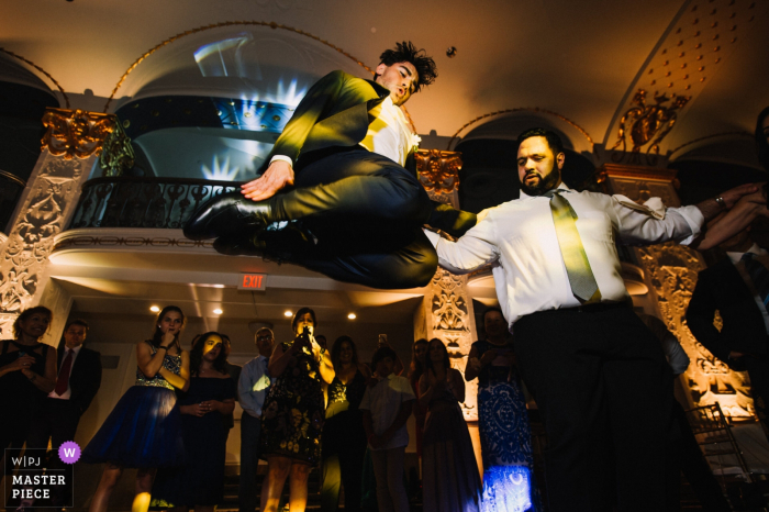 Photo by: <a href="https://www.wpja.com/contests/2019-v18/best-wedding-photographers/2567962">Ken Pak - Washington DC District Of Columbia</a> Mayflower Hotel, Washington, D.C Wedding Photographer: Bestman's special Greek dance by making the highest jump