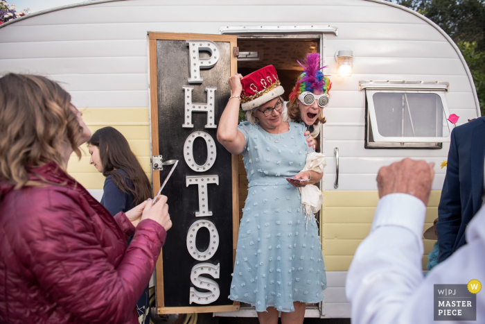 Photo by: <a href="https://www.wpja.com/contests/2019-v18/best-wedding-photographers/2568028">Stephanie Secrest - Arroyo Grande California</a> Oakland, CA, wedding reception photography. People having fun with the Photo Booth.