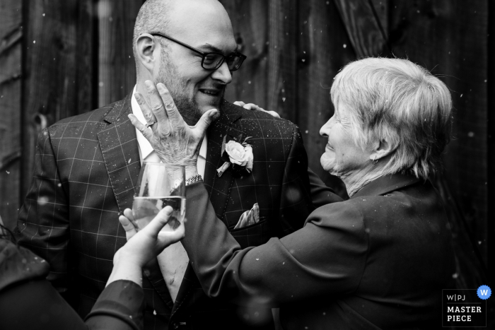 Photo by: <a href="https://www.wpja.com/contests/2019-v18/best-wedding-photographers/2568064">David Clumpner - Missoula Montana</a> Missoula, Montana grandma and groom - Wedding photography in black and white.