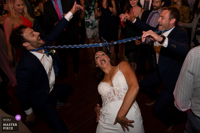 Photo by: <a href="https://www.wpja.com/contests/2019-v18/best-wedding-photographers/2568067">Matt Theilen - South Lake Tahoe California</a> Squaw Valley, CA wedding reception photos of the Bride limbo