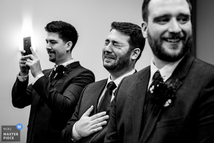 Photo by: <a href="https://www.wpja.com/contests/2019-v18/best-wedding-photographers/2568116">Esther Gibbons - Montreal Quebec</a> Montreal Courthouse Wedding Photography | Reaction of the men during the wedding ceremony