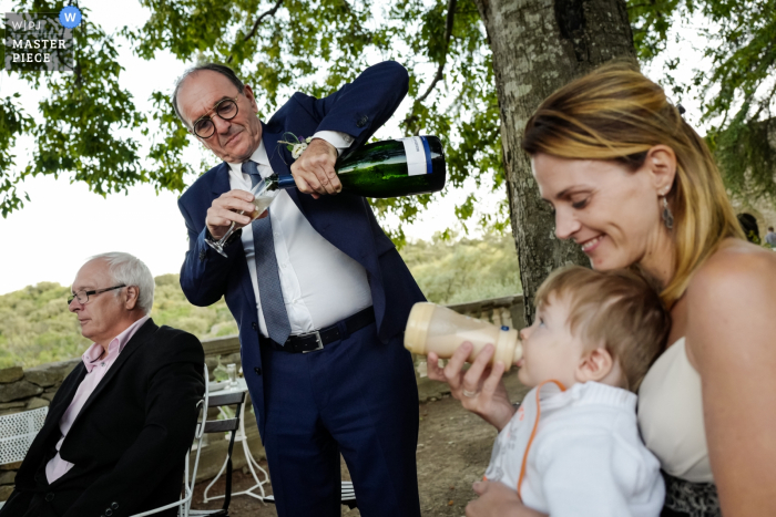 Photo by: <a href="https://www.wpja.com/contests/2019-v19/best-wedding-photographers/2568722">William Lambelet - Montpellier </a> Aumelas, France wedding image contains: Drinking all together, kids, adults, reception, trees