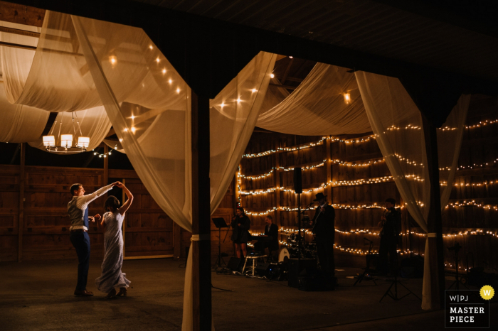 Photo by: <a href="https://www.wpja.com/contests/2019-v19/best-wedding-photographers/2568990">Ken Pak - Washington DC District Of Columbia</a> Murray Hill, Leesburg, VA wedding image contains: Groom dancing with his mother showing the band and venue.