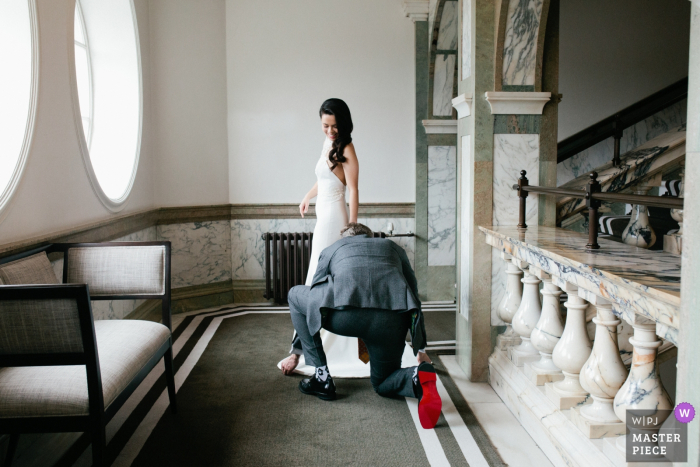 Photo by: <a href="https://www.wpja.com/contests/2019-v19/best-wedding-photographers/2570517">Matilda Delves - Canterbury Kent</a> Kent wedding photograph of the bride having her dress adjusted