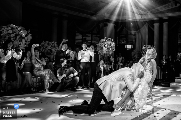 Photo by: <a href="https://www.wpja.com/contests/2019-v19/best-wedding-photographers/2570834">Chanarthip Cheingthong - Bangkok </a> Bangkok Garter removal - wedding photography from the dance floor of the bride and groom