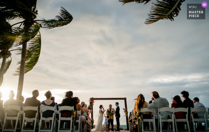 Photo by: <a href="https://www.wpja.com/contests/2019-v19/best-wedding-photographers/2571160">Michael Freas - Key West Florida</a> Fort Zachary Taylor, Key West, Florida wedding photographer: Ringer bearer wanted attention when his mom was center stage at the ceremony.