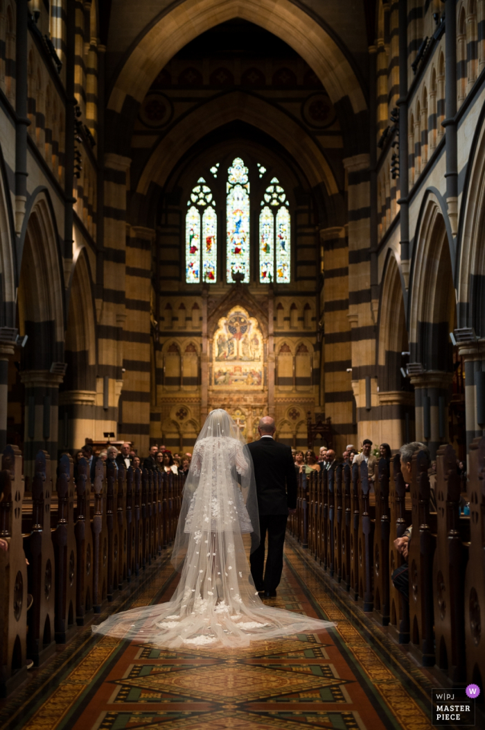 Photo by: <a href="https://www.wpja.com/contests/2019-v19/best-wedding-photographers/2571439">Jiake Yang - Melbourne Victoria</a> Melbourne wedding photographer: The bride and father went to church.