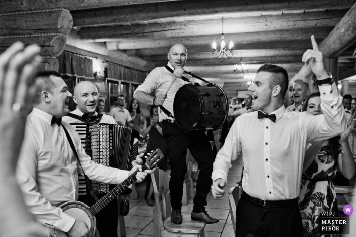 Photo by: <a href="https://www.wpja.com/contests/2019-v19/best-wedding-photographers/2571608">Wojciech Marzec - Krakow </a> Krakow Malopolskie Reception Venue Photo - The wedding band gets the party started.