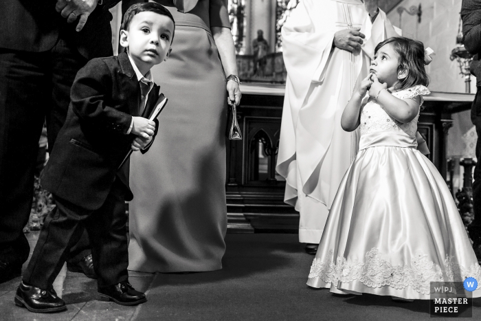 Photo by: <a href="https://www.wpja.com/contests/2019-v19/best-wedding-photographers/2571670">Alexandre Tessler - Porto Alegre Rio Grande do Sul</a> Paróquia São Pedro, Porto Alegre City, Brazil - Wedding Photos - The children were agitated and anxious waiting for the bride to enter the church.