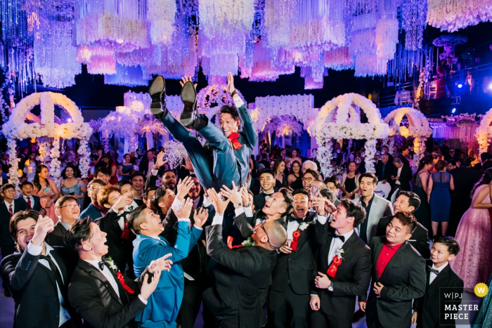 Panama wedding reception photo of the groom tossing