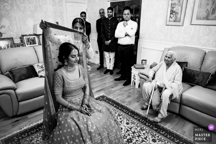 Liverpool, UK wedding photo of an Asian bride getting ready for the ceremony