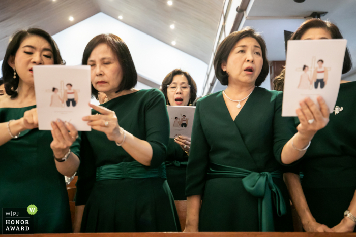 Wattana Church Wedding Photo of the Women During Ceremony Singing together Wattana Church Wedding Photo of the Women During Ceremony - Sing together