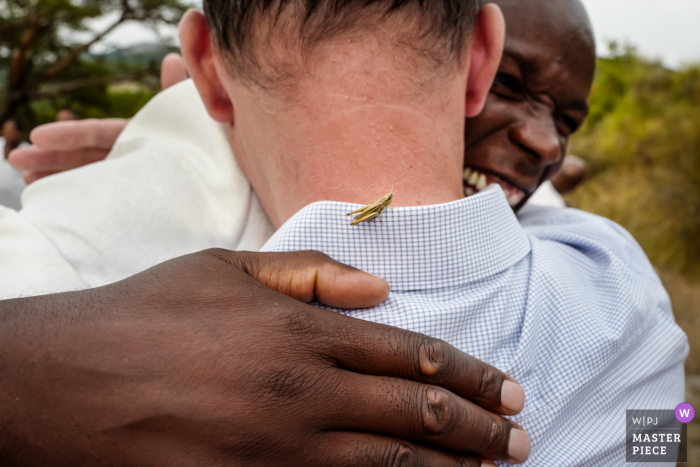 Vesc, France wedding photography | Grasshopper hugs and men