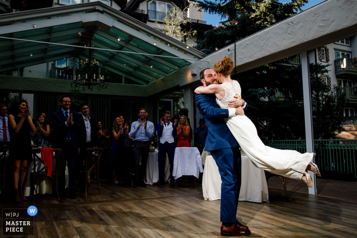 groom lifting the bride during the first dance Vail, CO wedding photographer: The groom lifting his bride during their first dance.